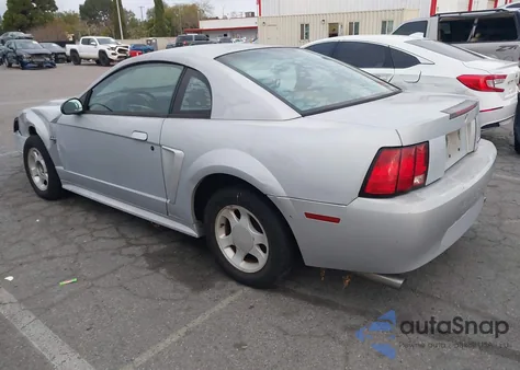 1999 Ford Mustang из США, поврежденный, VIN 1FAFP4041XF136988